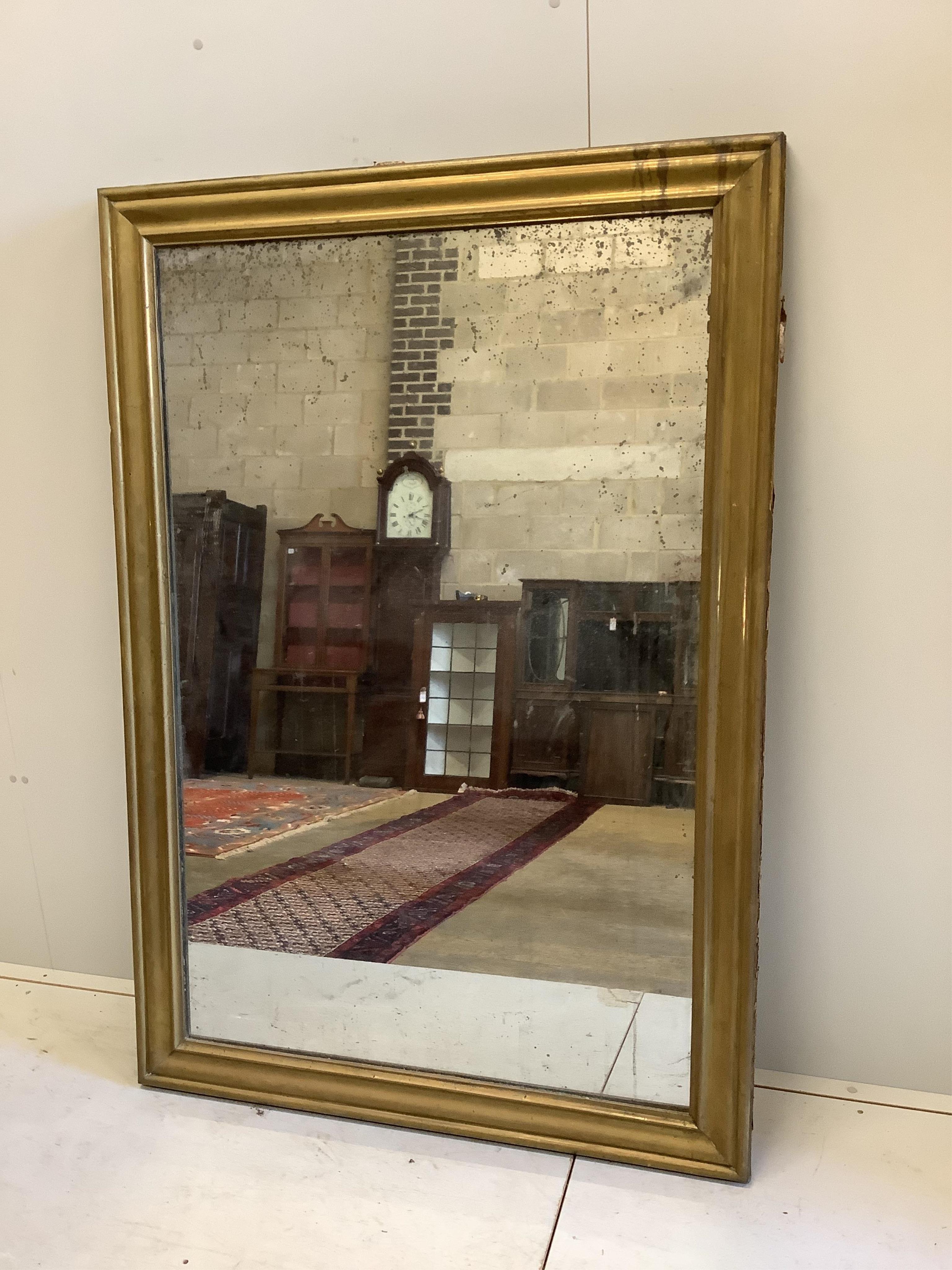 A Victorian brass framed wall mirror, width 109cm, height 158cm. Condition - fair, plate oxidised